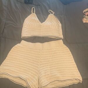 This is a two piece knitted white shorts outfit all white